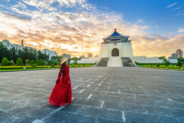 Asian woman walking in Archway of Chiang Kai Shek Memorial Hall in Taipei, Taiwan.