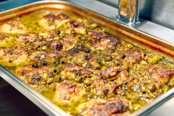 Deliciously Baked Chicken Thighs with Olives in Savory Green Sauce, Perfectly Seasoned for a...