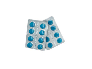 A blue pill is on a white background. There are six pills in total. The pill is in the middle of...