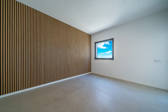 Room with wooden wall texture with wood acoustic panels pattern with window