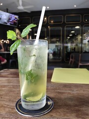 Mint Mojito on a wooden table in a restaurant