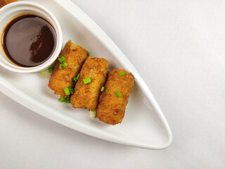 Japanese Croquettes Korokke in a beautiful white tray with sauce
