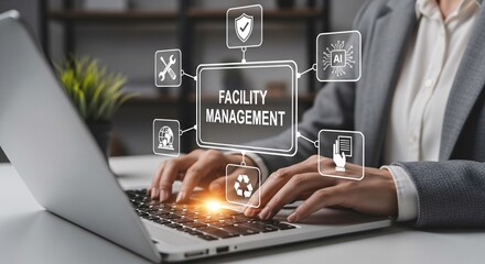 Fototapeta premium Facility Management Concept. Professional works on laptop with digital icons representing facility management, security, maintenance tools, AI, sustainability, safety, and smart building operations.
