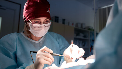 Dentist performing dental procedure in clinical setting