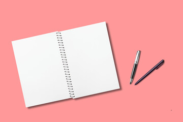 Blank Spiral Notebook with Pens on Solid Color Background – Stationery Flat Lay for Notes, Journaling or Planning

