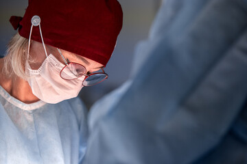 Focused surgeon working in operating room with precision handling medical procedure