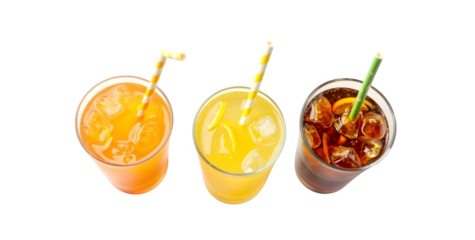 An overhead shot of glasses containing orange soda, lemon-lime soda, and cola drinks, complete with ice and straws, isolated on a white surface.
