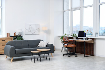 Stylish workplace with modern computer on wooden desk