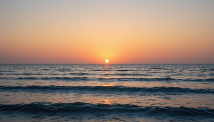 Over serene ocean water, a pastel sunset