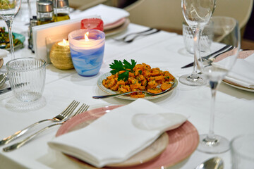 An Elegant Dining Table Setting Featuring Exquisite Plates and Elegant Table Decor for a Memorable Culinary Experience