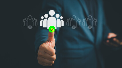 Businessman giving thumbs up with icon of selected group of people. Concept for recruitment, candidate selection, HR management, team building, leadership, hiring decision, and talent acquisition.