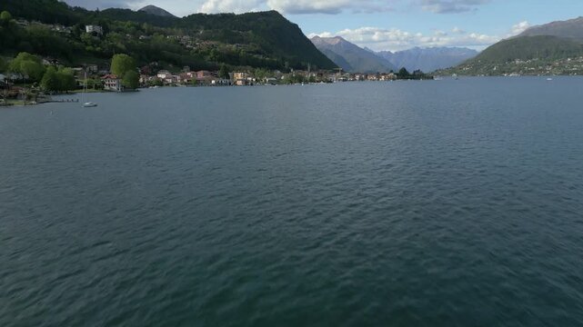 Aerial Tilt-Up from Lake Orta to Pella Village, Italy &ndash; Scenic Drone Shot of Waterfront and Mountains


