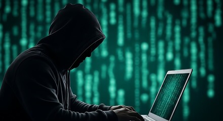 Hacker using laptop to commit cybercrime and data breach in the dark