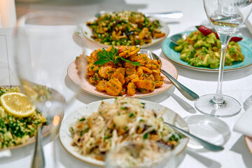 A Vibrant Spread of Culinary Delights Featuring Shrimp, Pasta, and Fresh Ingredients Perfectly Arranged for an Inviting Meal Experience