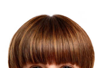 Close up of a person with brown hair and bangs partially covering their face with dark eyes visible