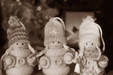 Fototapeta premium Three little angels in a knitted hat. Black and white photo.