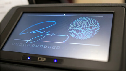 Biometric identification device displaying fingerprint and digital signature, showcasing advanced technology for secure