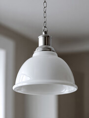 Obraz premium White pendant lamp hanging in a minimalist interior.