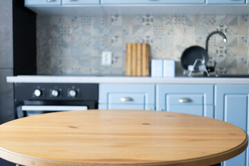 blurred kitchen interior and wooden desk space home background
