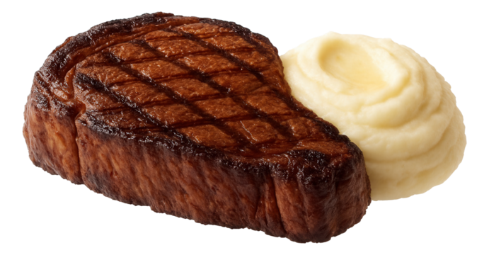 Pumpkin cream soup in a floral-patterned china bowl with a swirl of yogurt and a dash of cinnamon