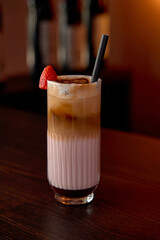 A Refreshing Strawberry Layered Drink with Creamy Coffee, Perfectly Balanced Flavors Served in a...