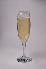 A Close-Up View of a Filled Champagne Flute Showcasing Sparkling Bubbles in a Refreshingly Crisp Beverage Ready for Celebration and Toasting Moments.