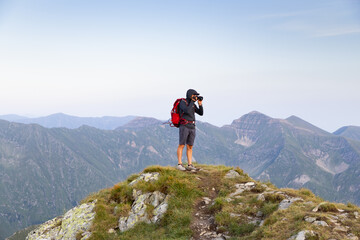 Fototapeta premium trekking with a dog in hogh mountains