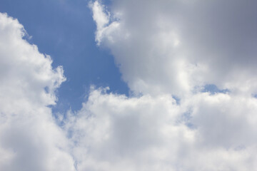 It's a blue sky with fluffy clouds.