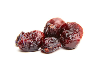 Dried cranberries arranged on a white background showcasing their rich color and texture,...
