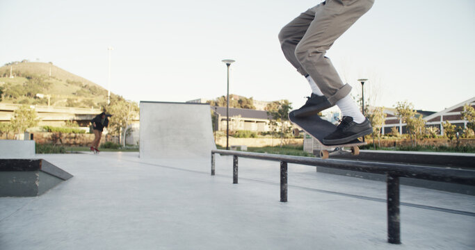 Skateboard, man and legs with balance on rail for grind stunt, performance challenge and skill. Skater, person and extreme sport at skatepark for physical activity, hobby and practice action trick - Powered by Adobe