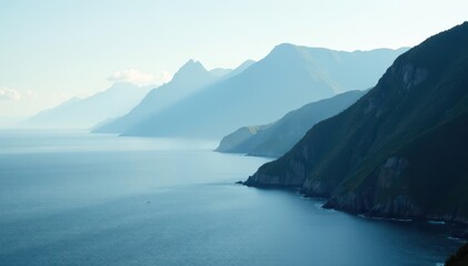 Misty mountain range descends to the sea, serene coastal scene , coastal mountains, shore