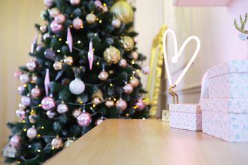 Elegant Christmas Tree with Pastel Decorations and Heart-Shaped Neon Light