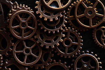 Close-Up of Interlocking Metal Gears and Cogs Against Dark Background