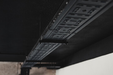 Cable tray supporting electrical wiring and data cables in building construction project