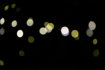 Abstract Bokeh Lights Background: Minimalist Dark Scene with Blurred Illuminations