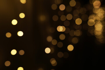 Golden Yellow Bokeh Background with Abstract Defocused Light Patterns