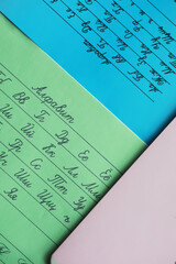 Handwritten Cyrillic Script on Colorful Paper Sheets for Educational Purposes and Language Learning