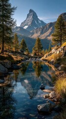 View of Matterhorn peak reflected in calm water with autumn colors in Swiss landscape at sunrise