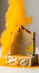 Stacked handmade soap bars dusted with turmeric powder.