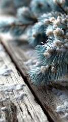 Winter landscape with snow-covered pine branches on rustic wooden surface
