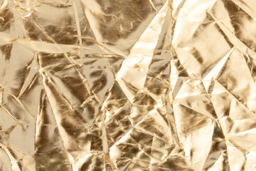 Crumpled Golden Aluminum Foil Texture Background