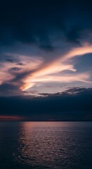 Sunset hues over a calm sea.