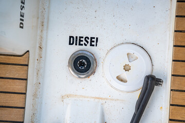 Diesel fuel inlet on the deck of a sailing yacht near Croatia, marked with the word Diesel....