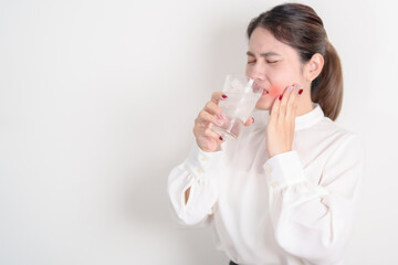 Business woman having toothache and pain after drink ice water for concept of Teeth Sensitive to...