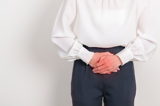 Business woman having Bladder pain for concepts of Bladder disease, Cancer Awareness Month May, Cystitis, Bladder Stone, urinary tract infection, UTI, Urethritis, Pyelonephritis, Urinary incontinence