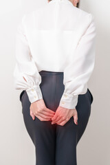 Business Woman having Anal symptoms pain for Hemorrhoids disease, Constipation, Anal cancer...