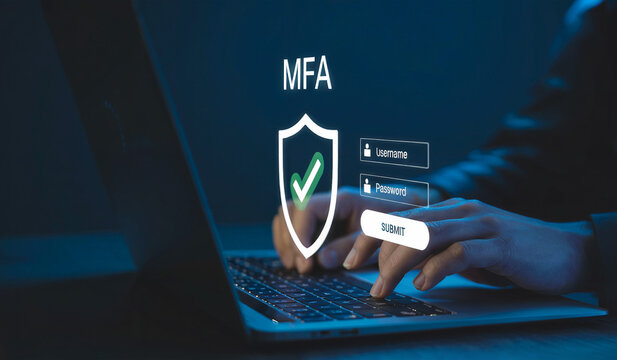 User Typing on Laptop with Multi-Factor Authentication (MFA) Security Shield Login Interface