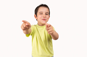 Portrait of happy boy pointing finger to camera and laughing loudly with surprised face, teasing making fun of you. indoor studio shot isolated on white background