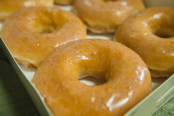 top view side view golden fresh donuts with sugar sweet glaze in box many delicious donuts