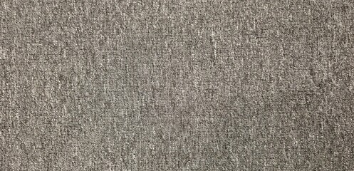 The floor of the conference room is covered with carpet. Gray carpet, close-up carpet, stage carpet, carpeted stage floor, texture and background image.